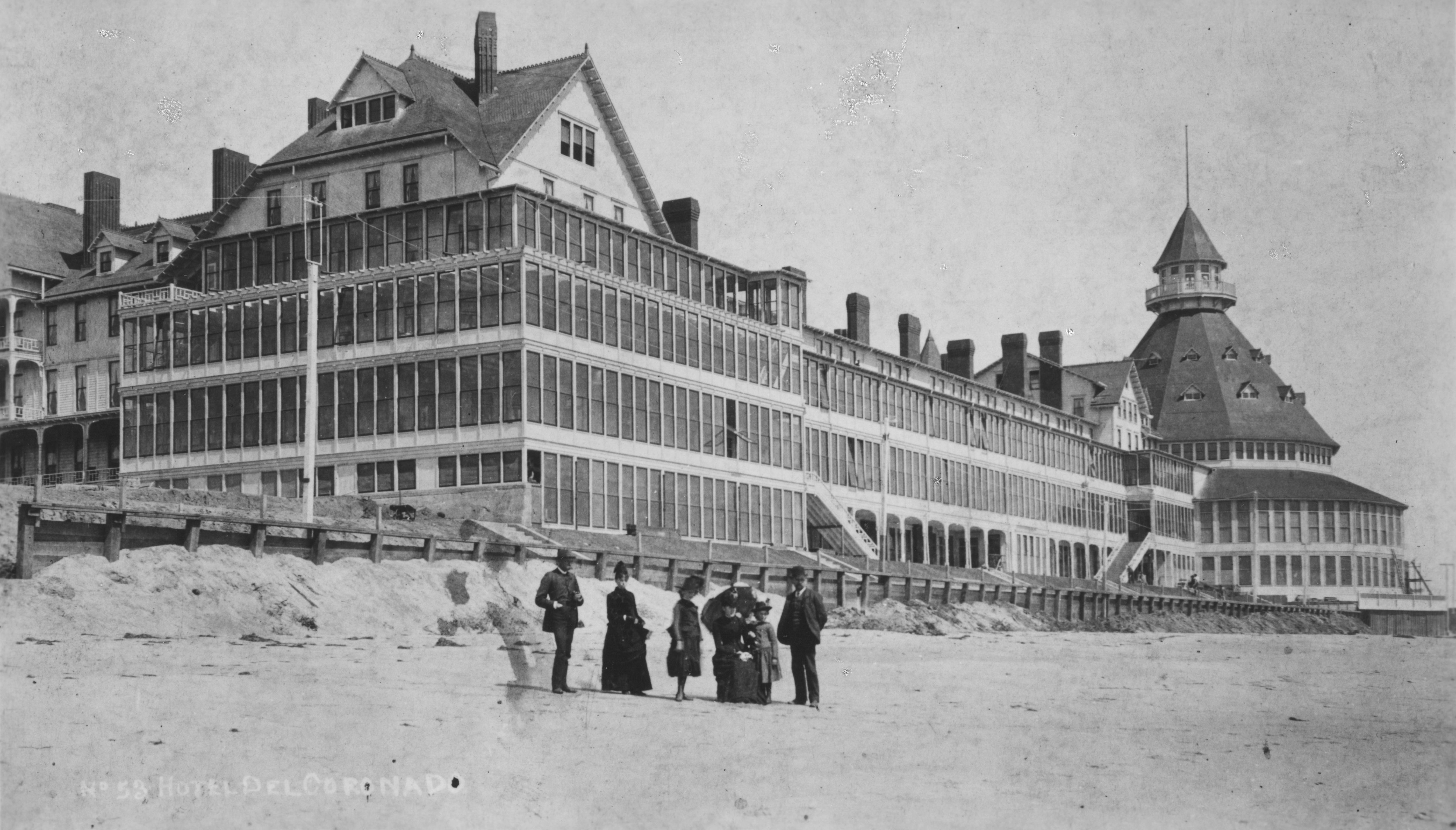 a group of people standing in front of a large building