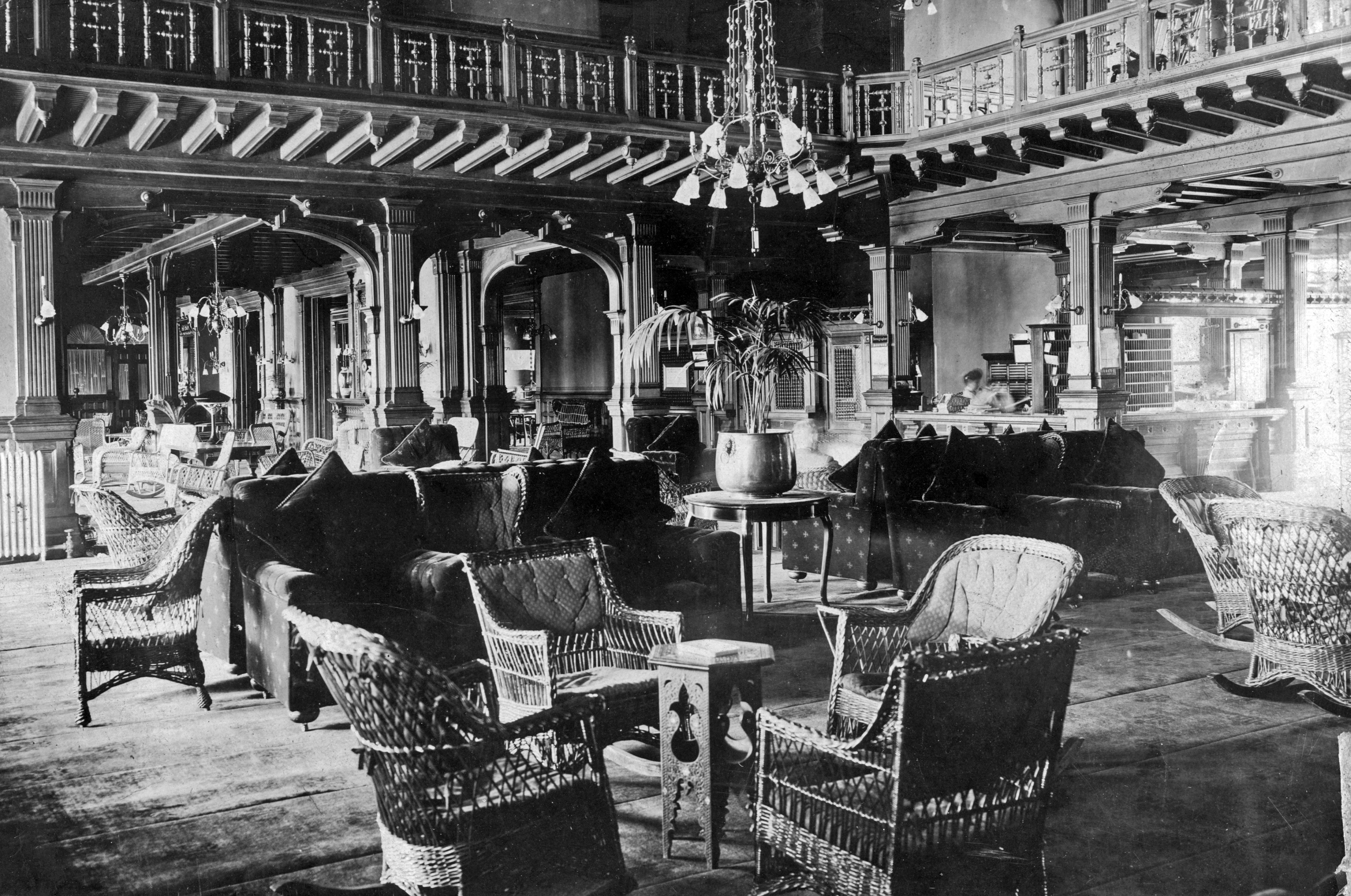 a room with chairs and a chandelier