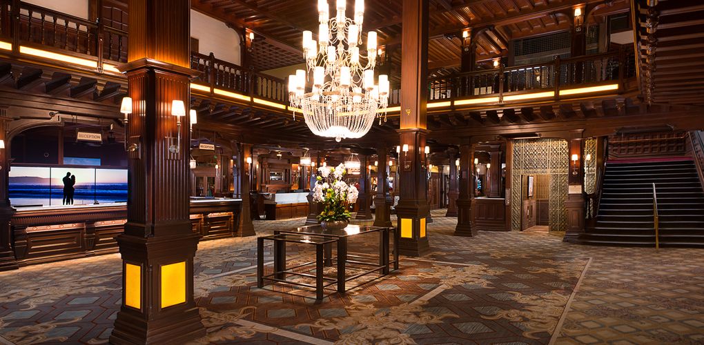 a large room with a chandelier and flowers