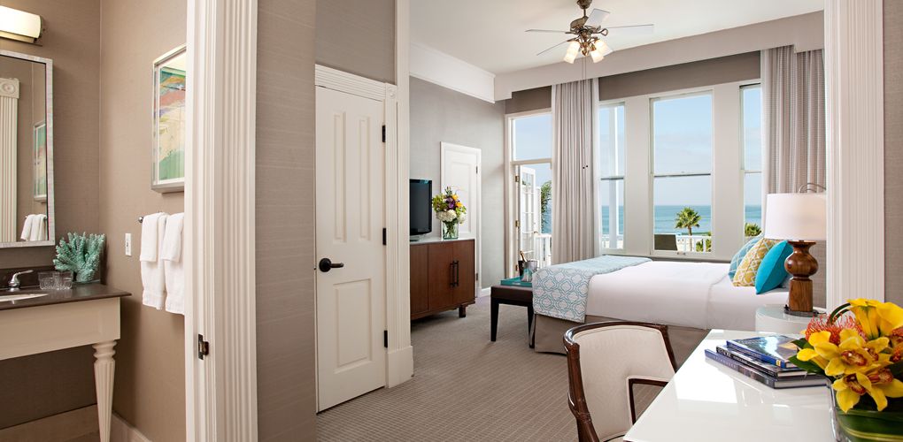 a room with a bed and a television