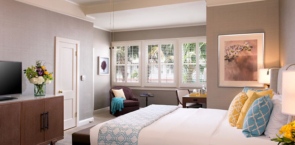 a bedroom with a bed and a chair