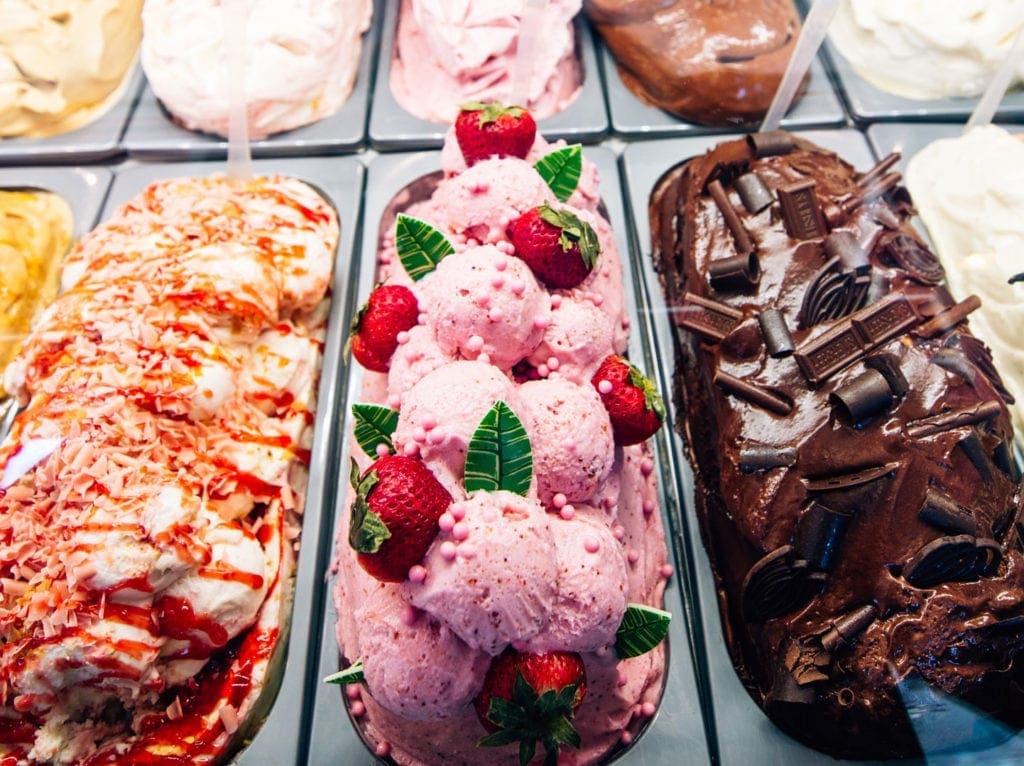 a row of ice cream in containers