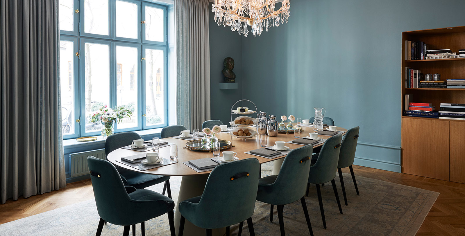 a dining room with a chandelier and a table