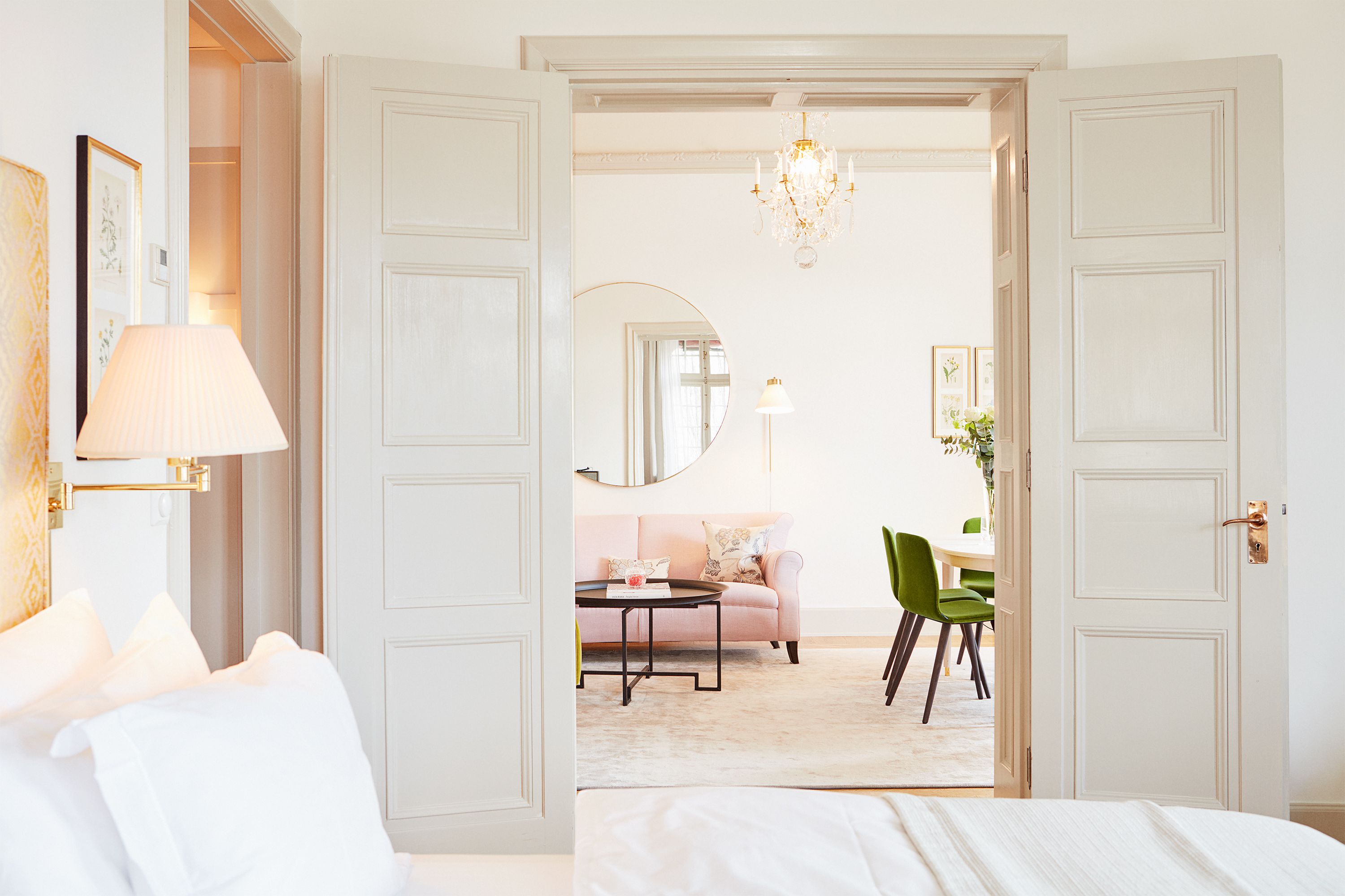 a room with a couch and a mirror