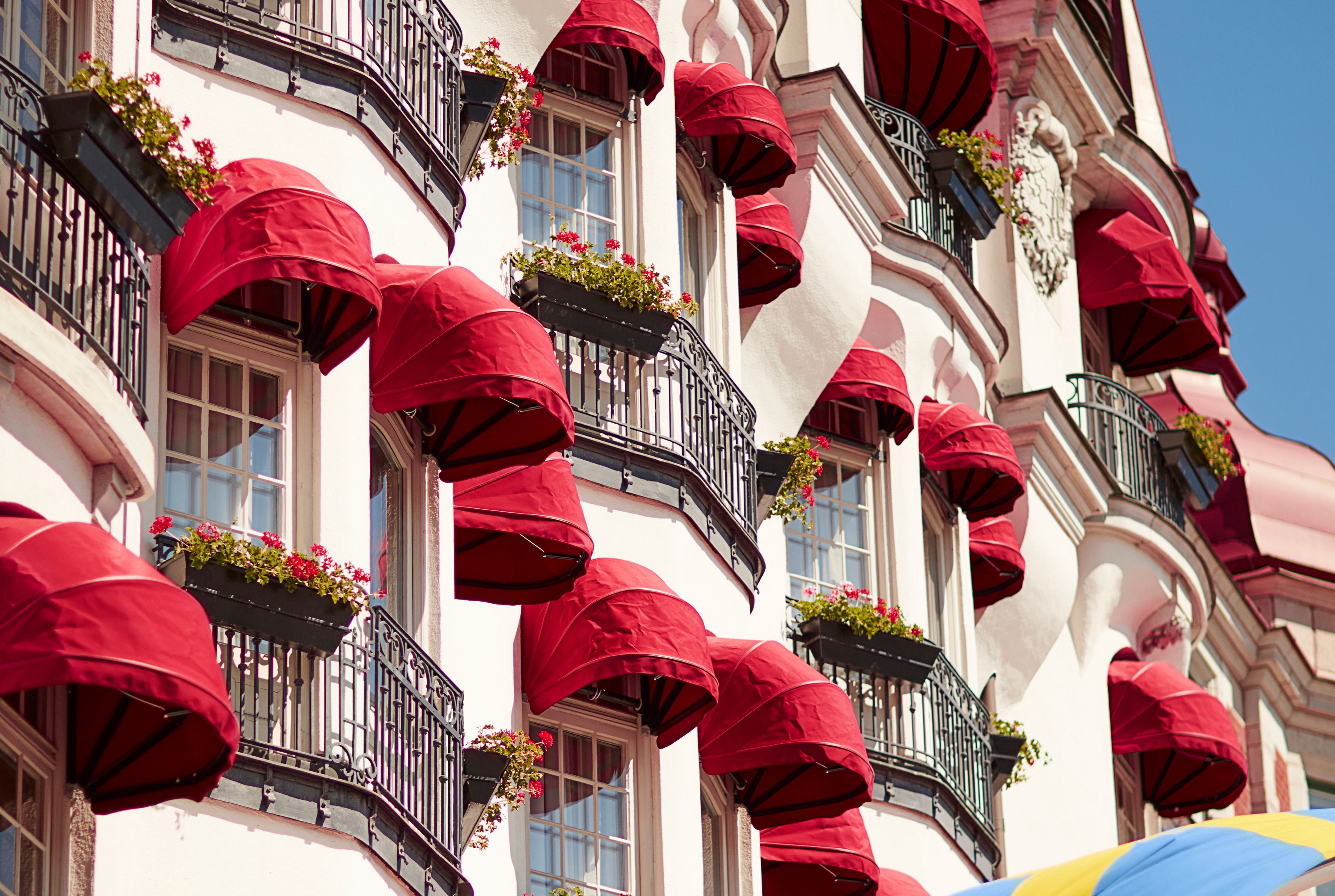 a building with red umbrellas