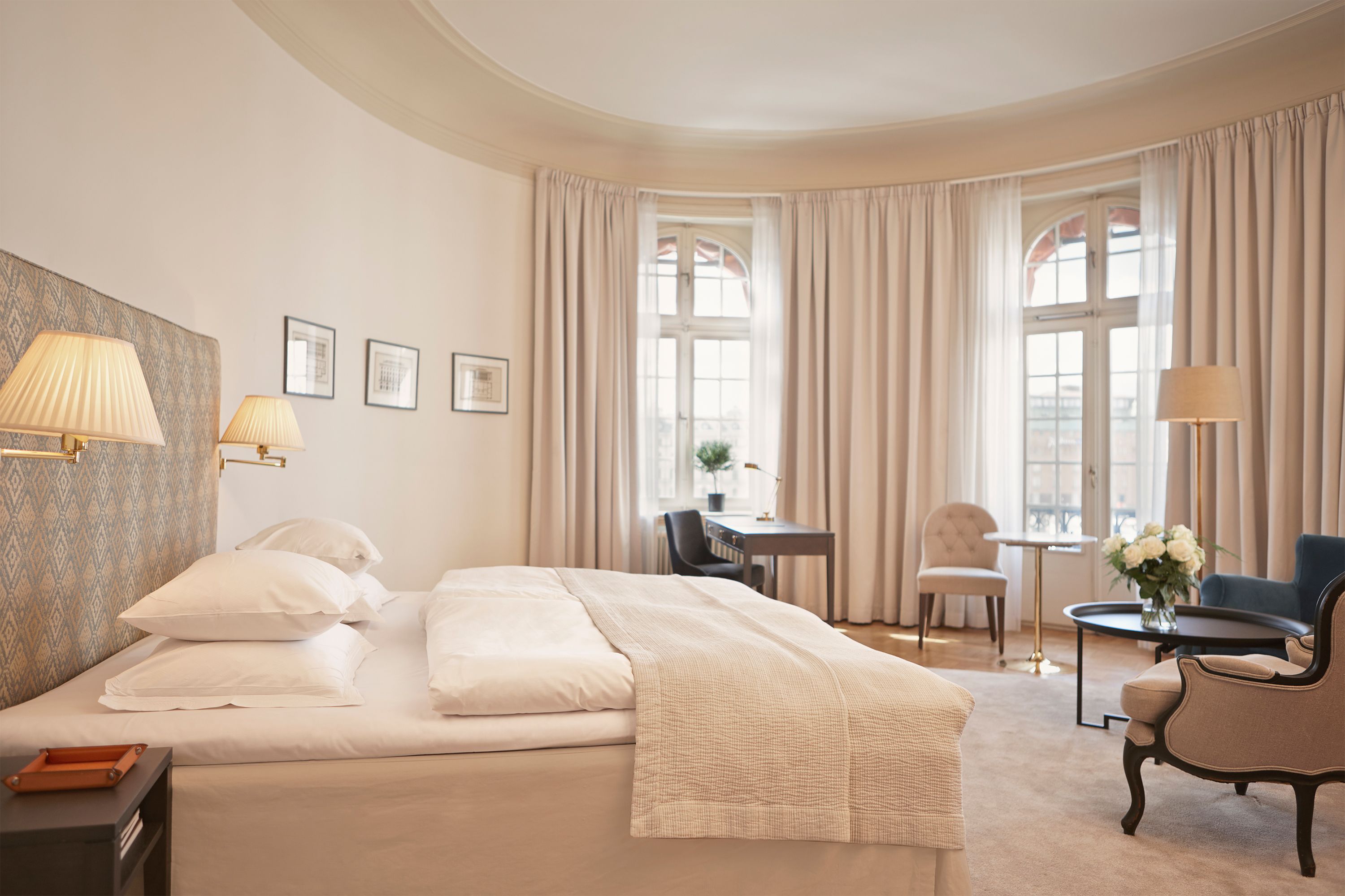 a bedroom with a bed and a table