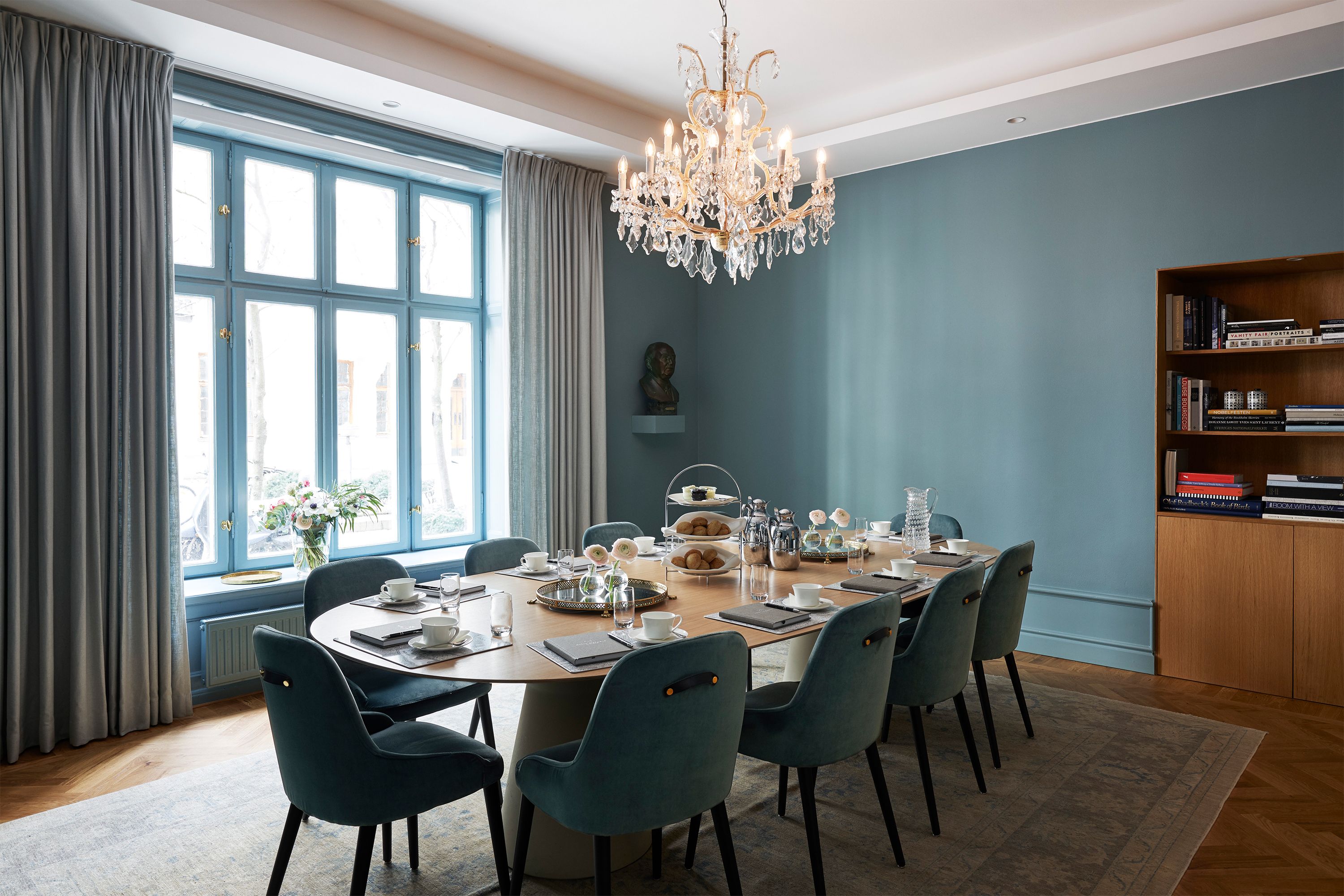 a dining table with a chandelier