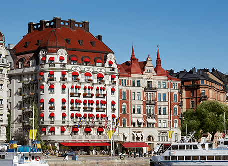 a building with many windows and red roofs