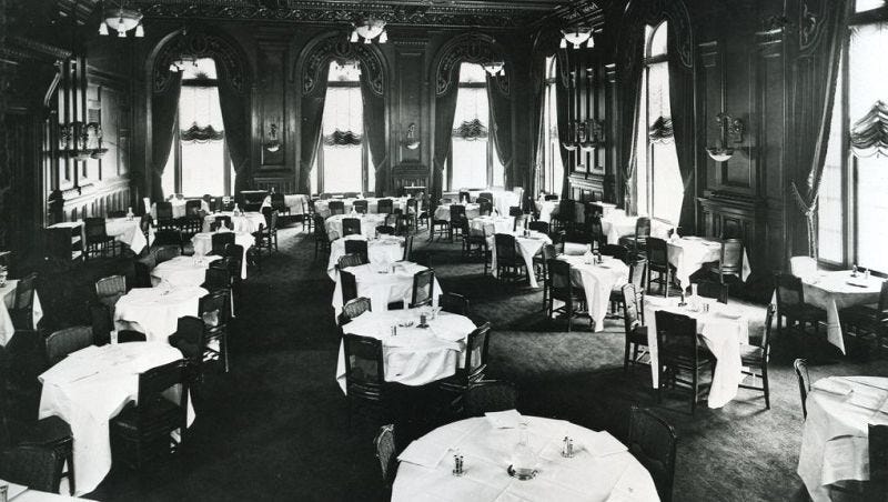 a room with tables and chairs