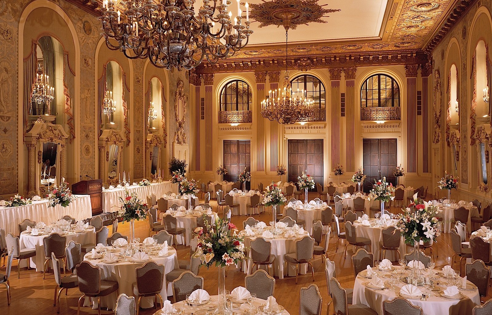 a large ballroom with tables and chairs