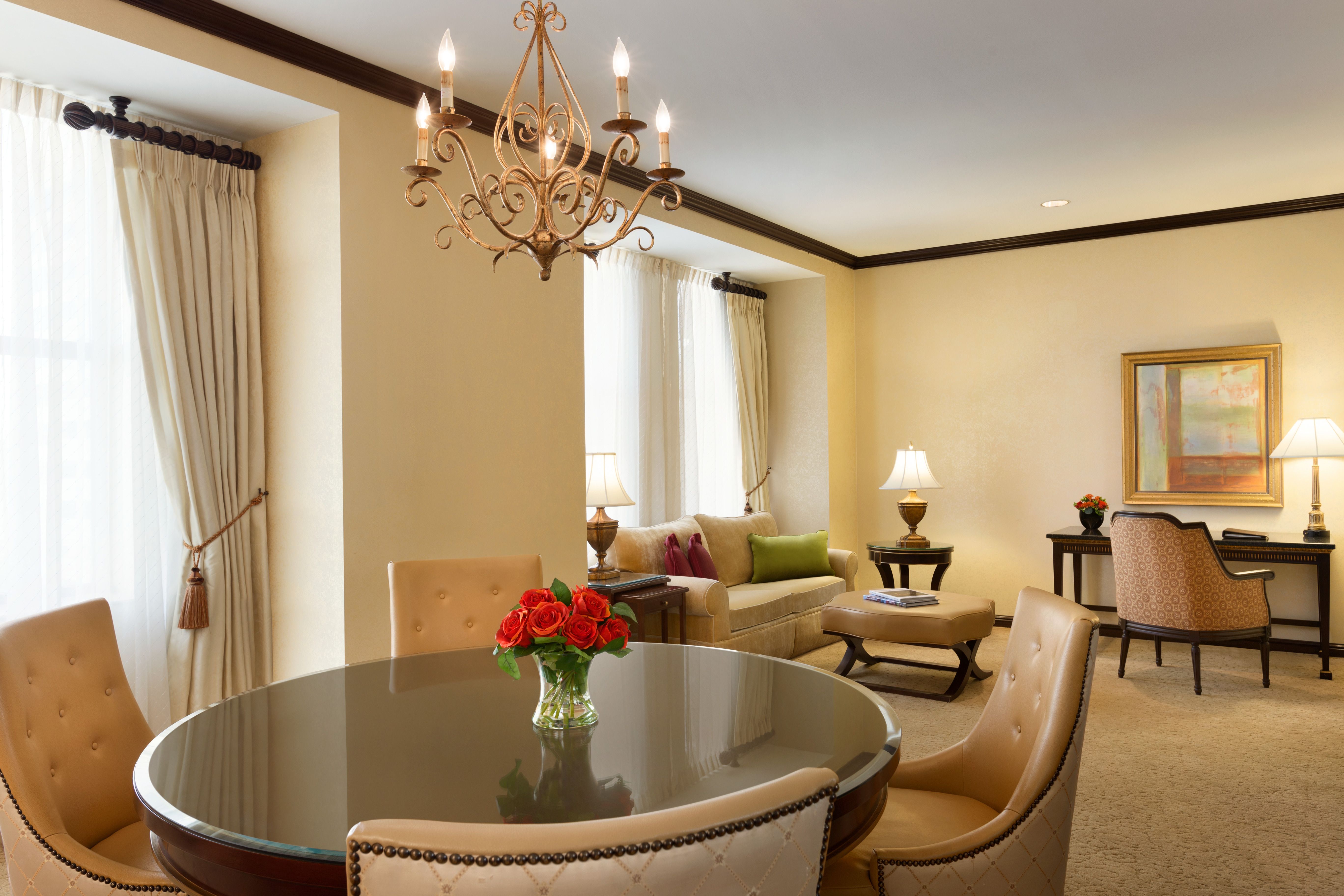 a living room with a chandelier and a table