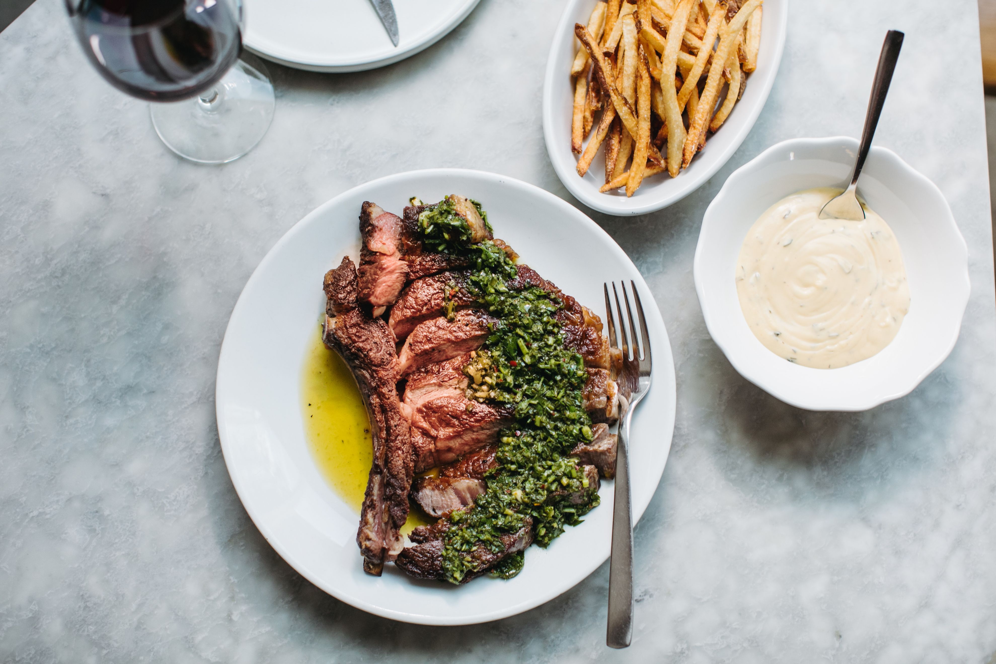 a plate of meat and french fries
