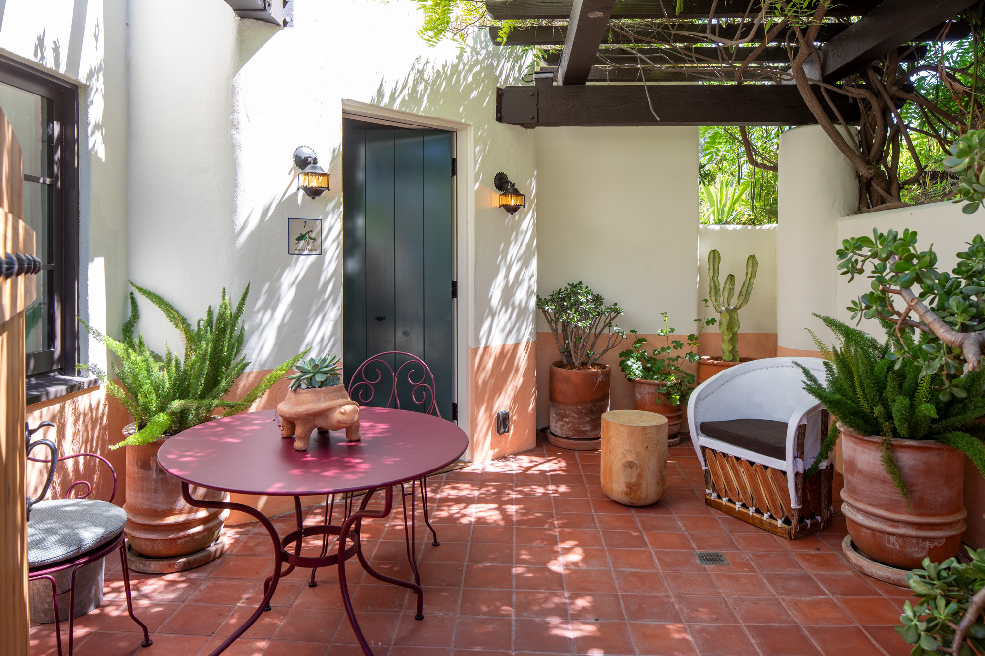 a patio with a table and chairs