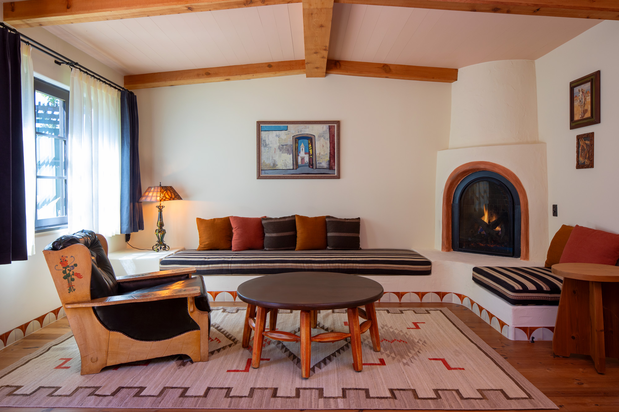 a living room with a fireplace and a couch