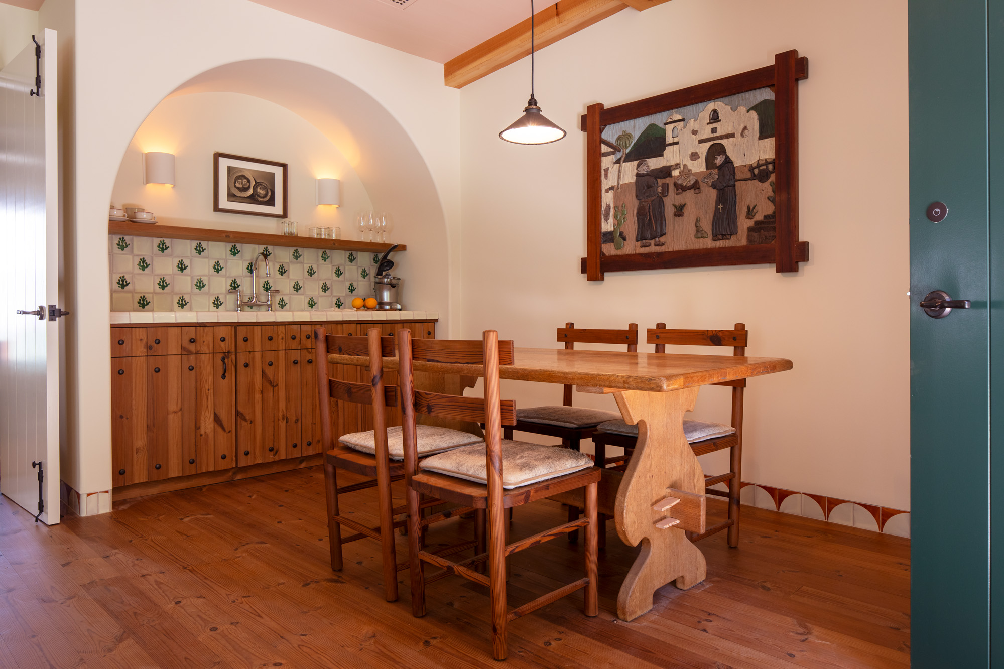 a dining table and chairs in a room
