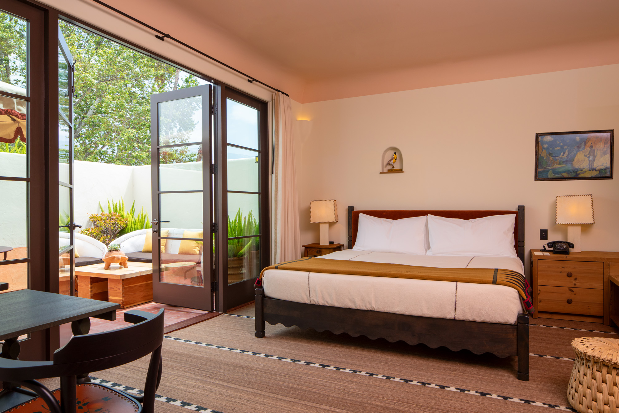 a bedroom with a bed and a glass door