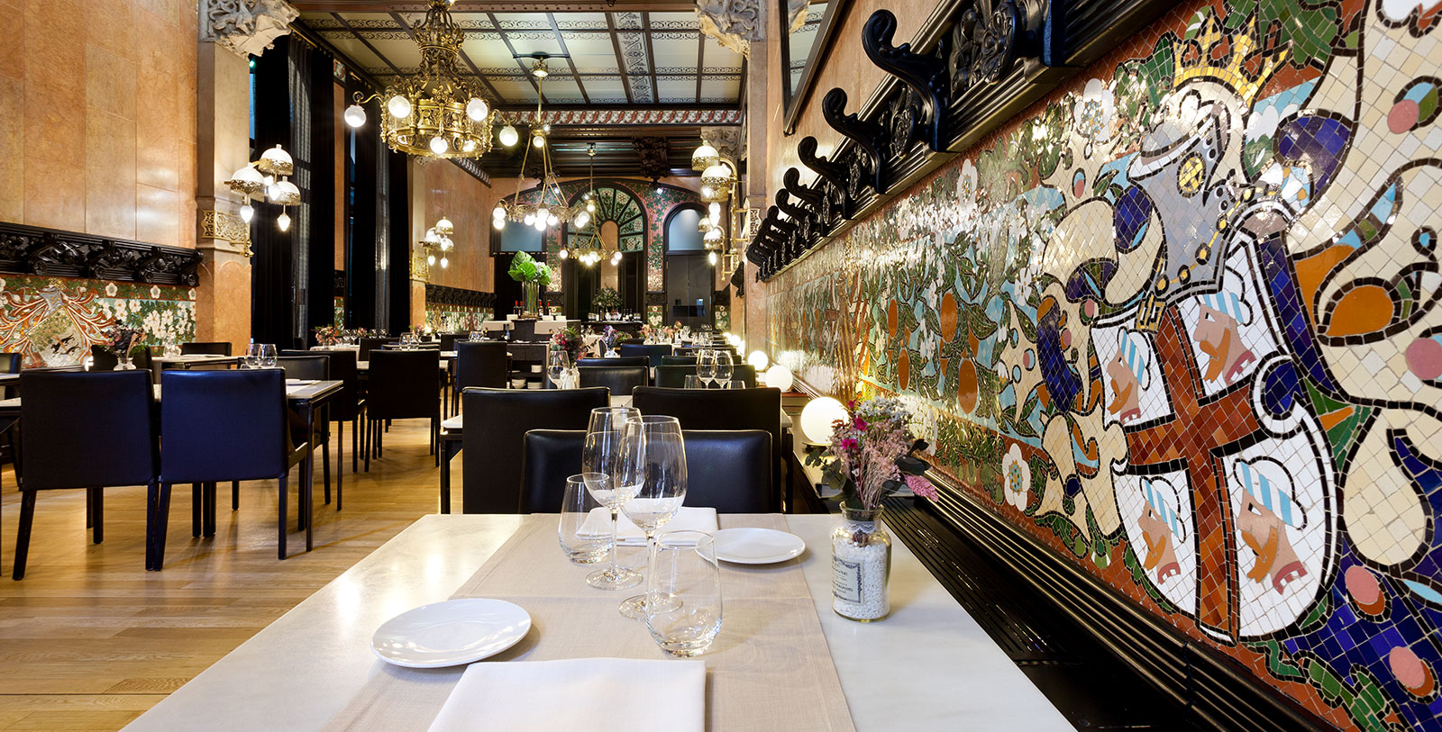 a restaurant with a large wall and many tables