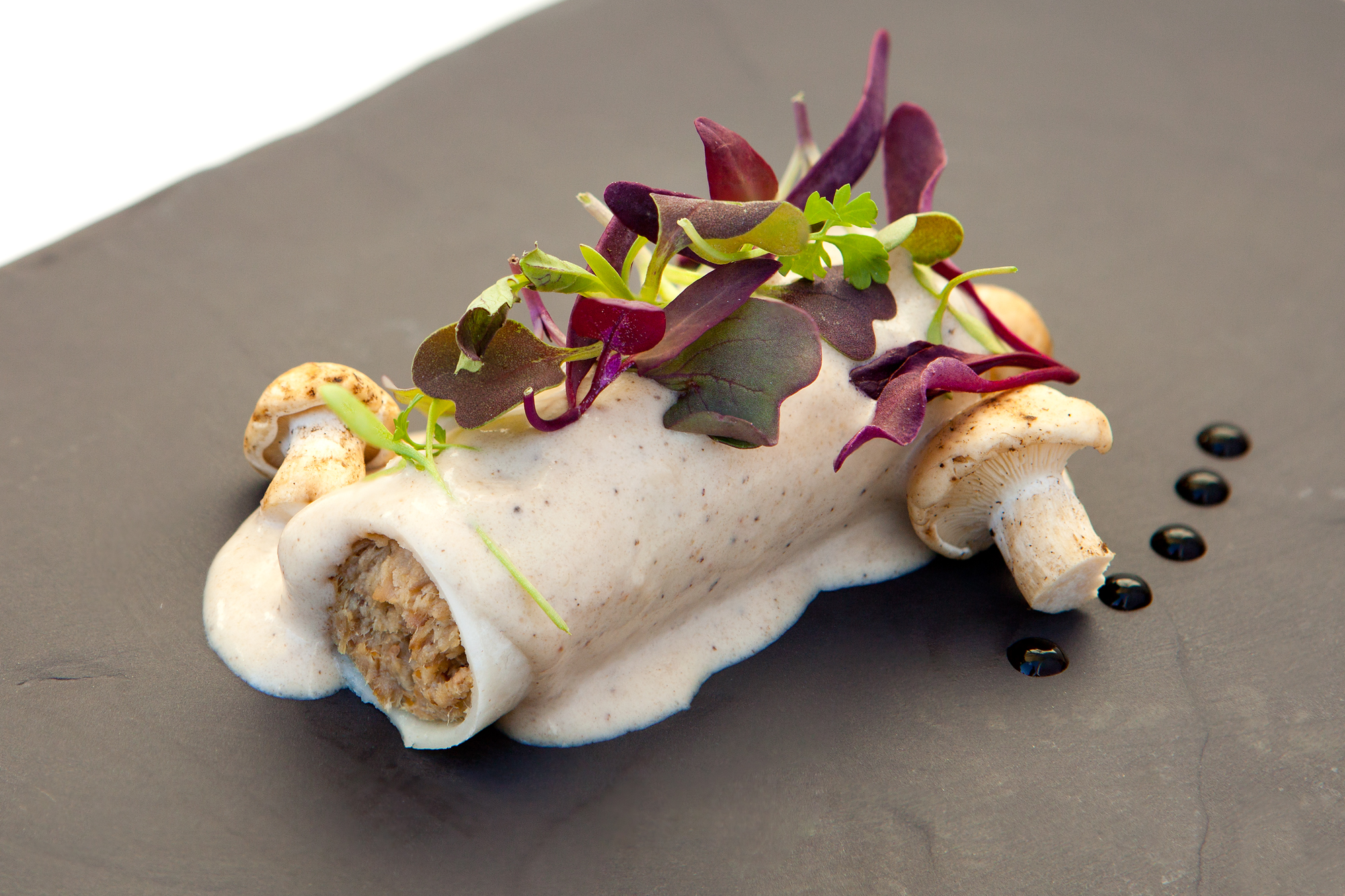 a plate of food with mushrooms and sauce