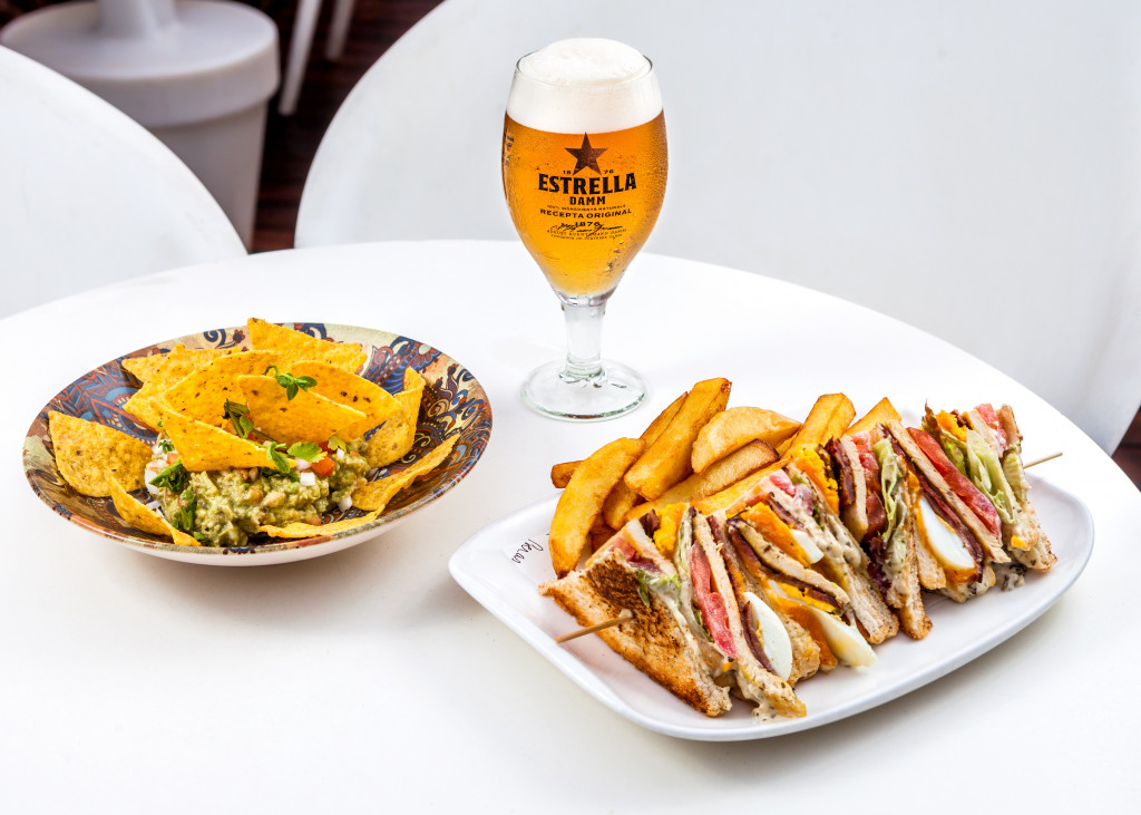 a plate of sandwiches and chips on a table