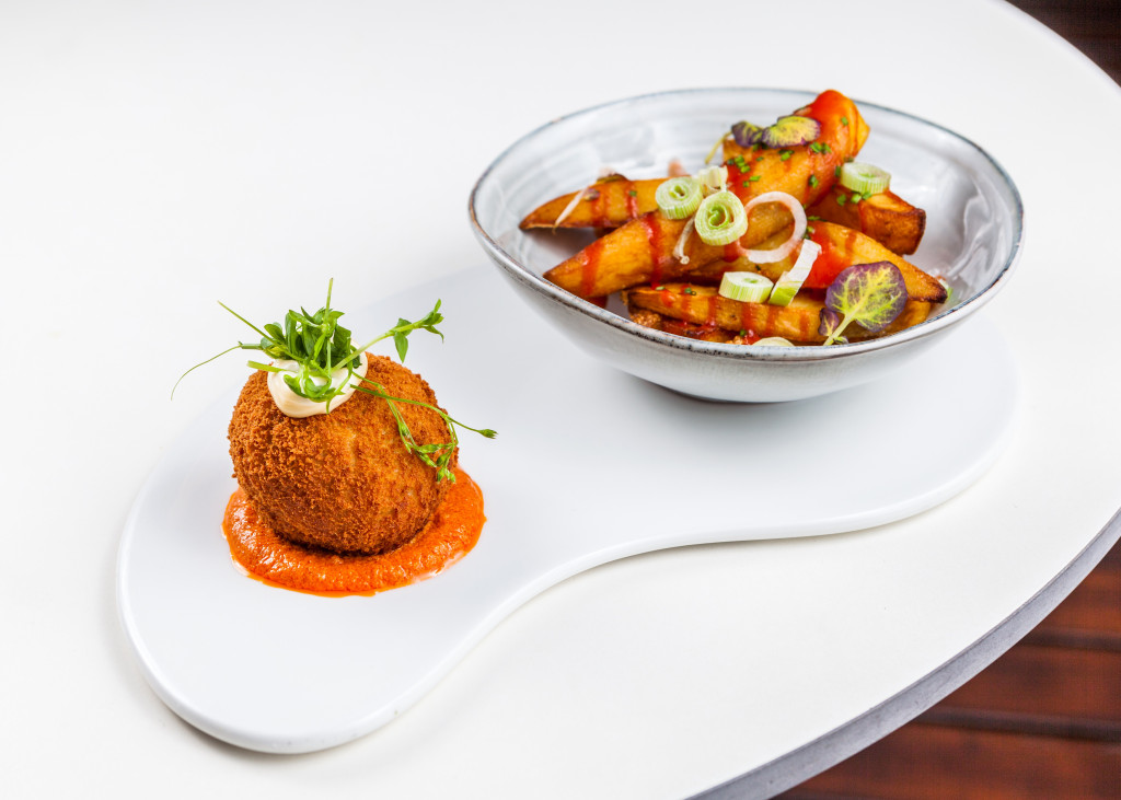 a plate of food on a white surface