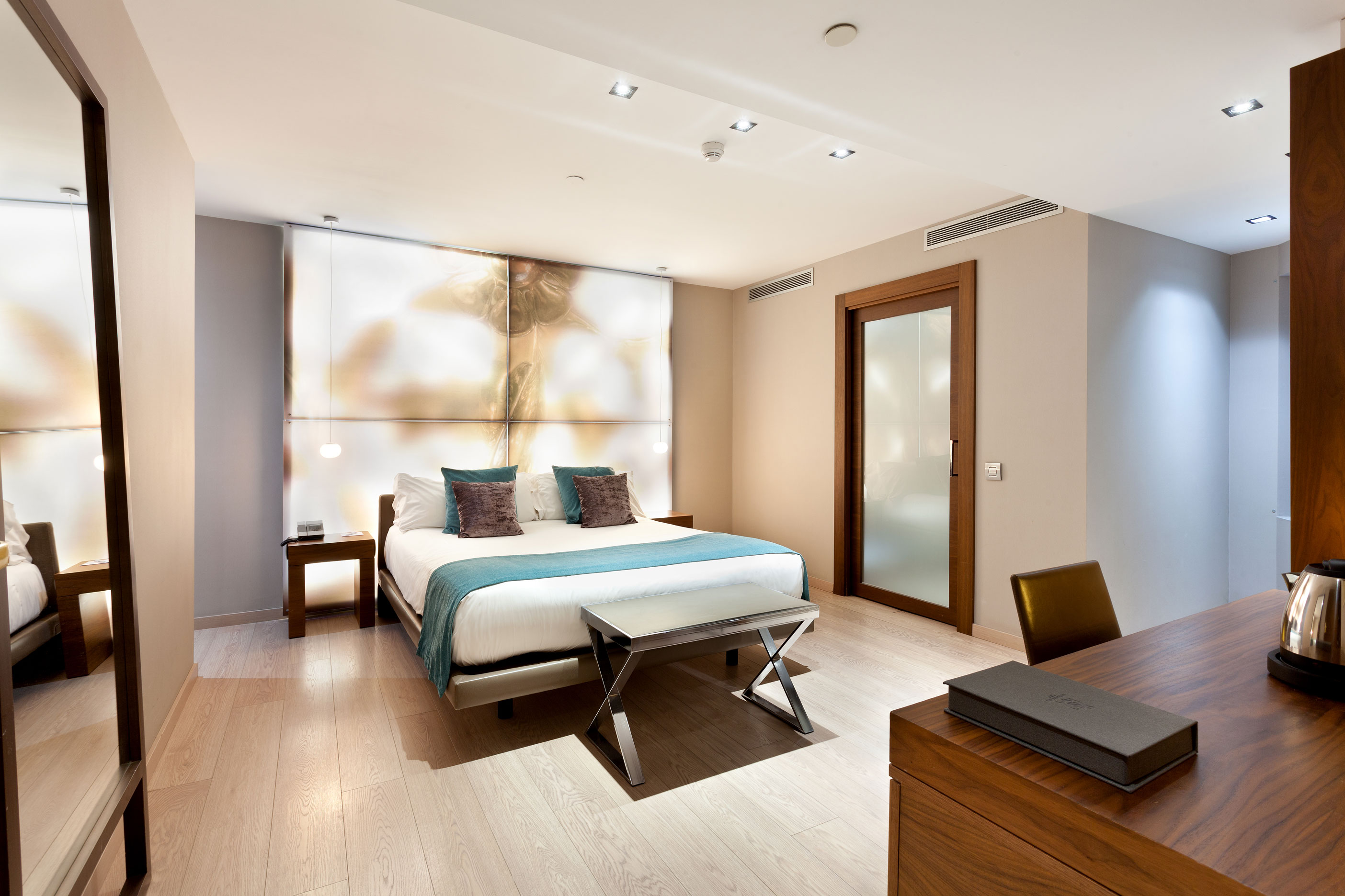 a bedroom with a bed and a desk