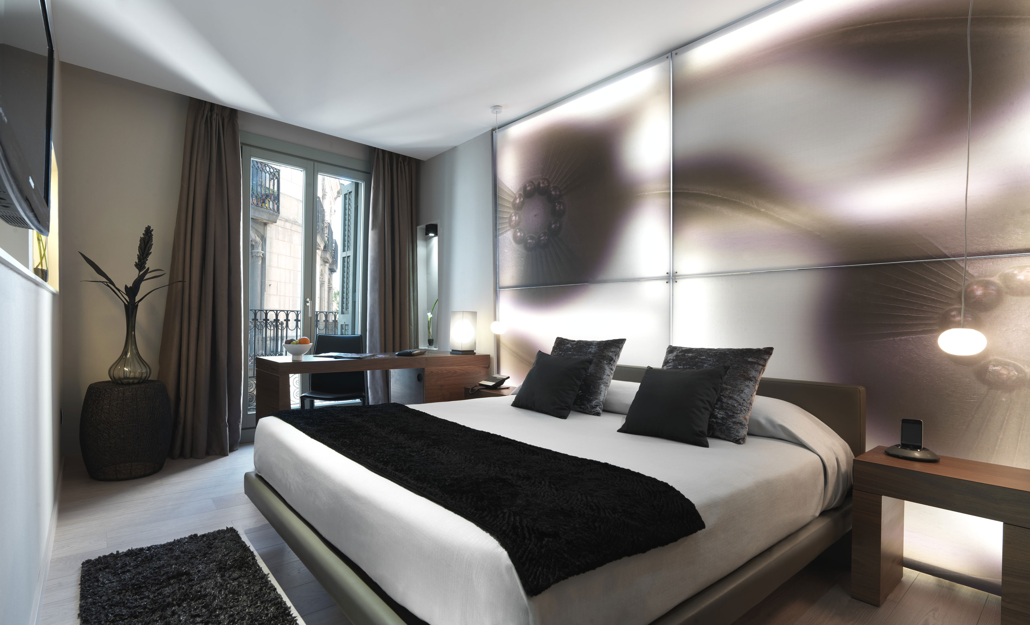 a bedroom with a bed and a desk