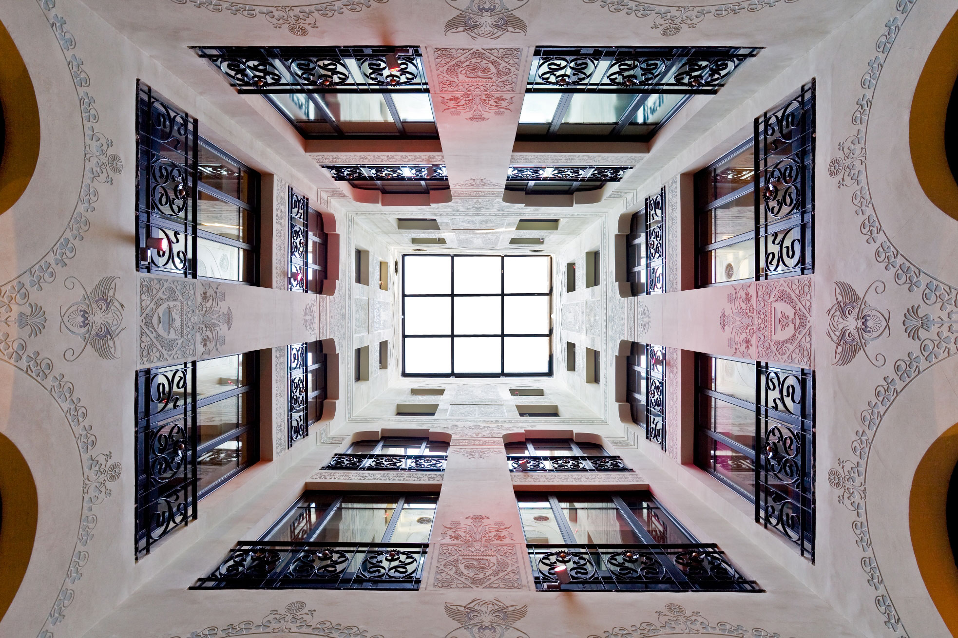 a looking up at a building with windows