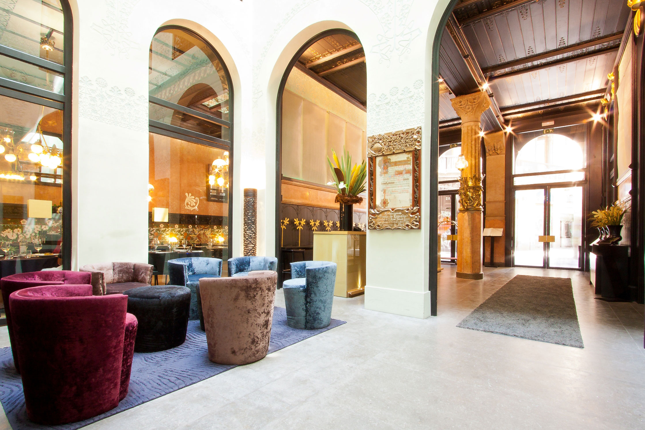 a room with many chairs and a rug