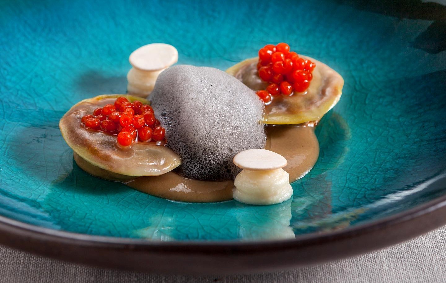 a plate of food with red berries