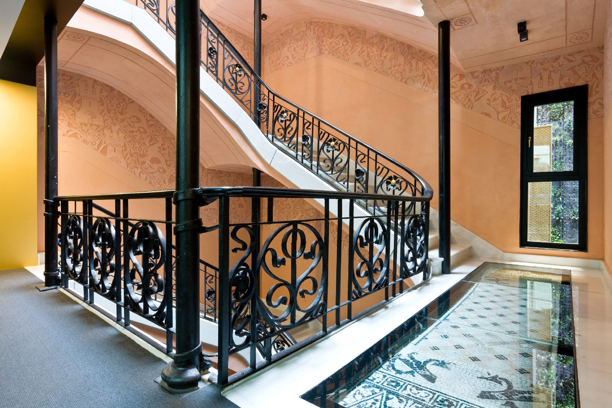a staircase with a black railing