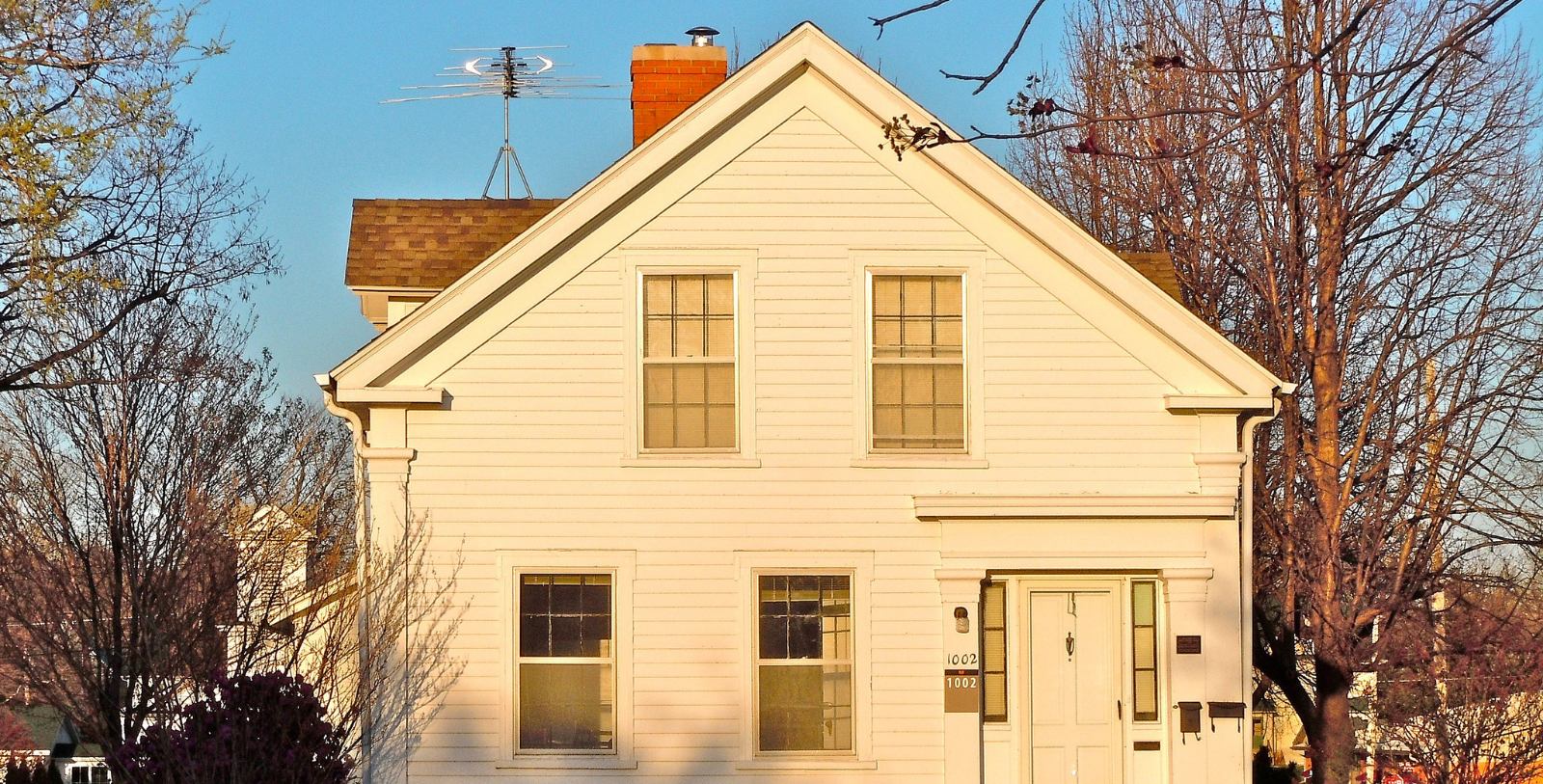 a house with a roof and a antenna