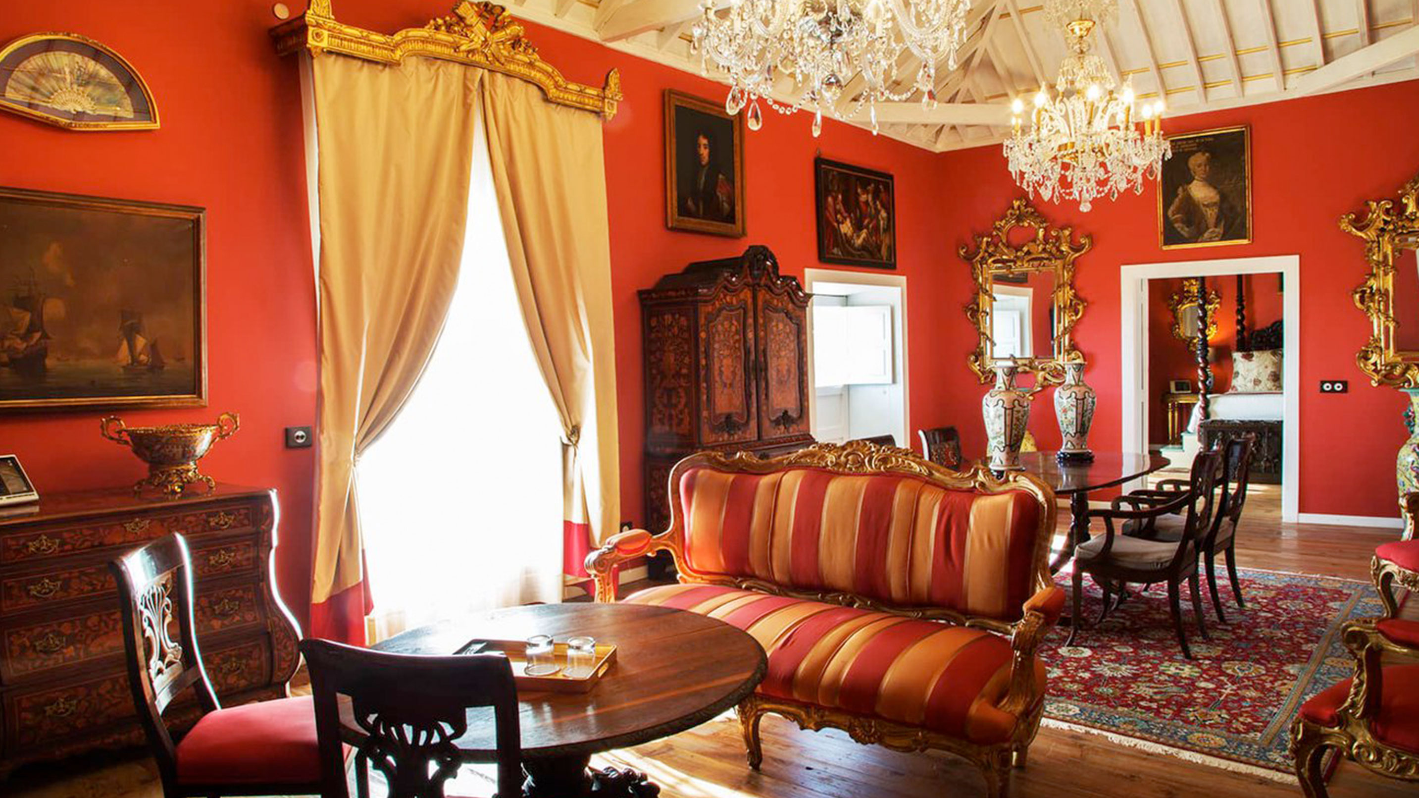 a room with a couch and chandelier