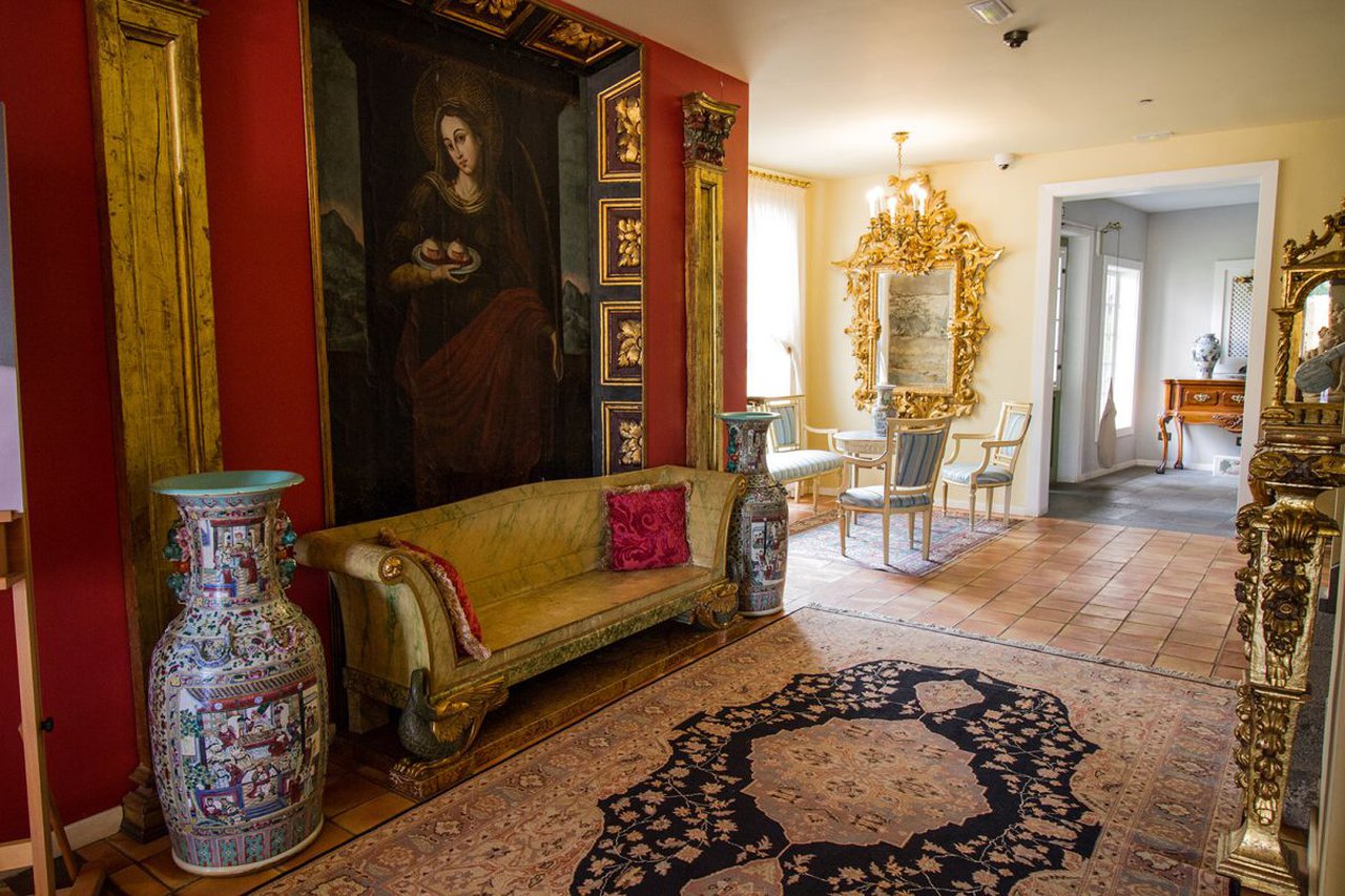 a room with a painting on the wall