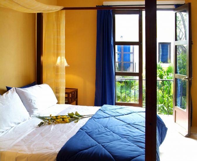 a bed with a flower on it