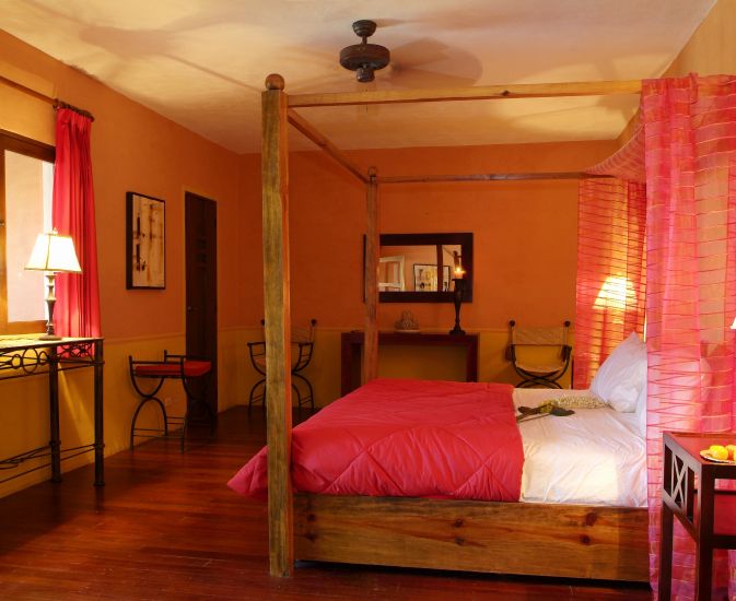 a bedroom with a four poster bed