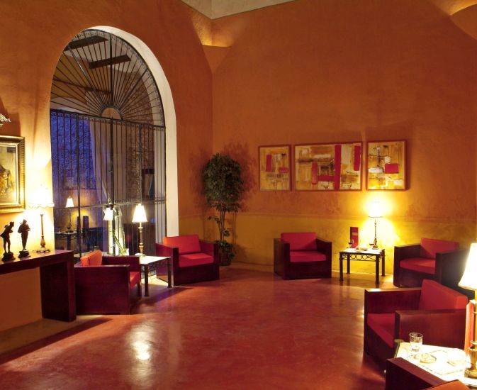 a room with red chairs and tables