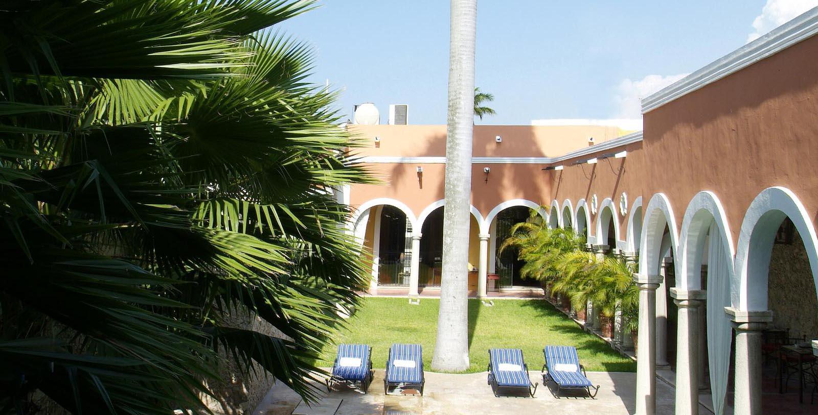 a group of lounge chairs in a courtyard