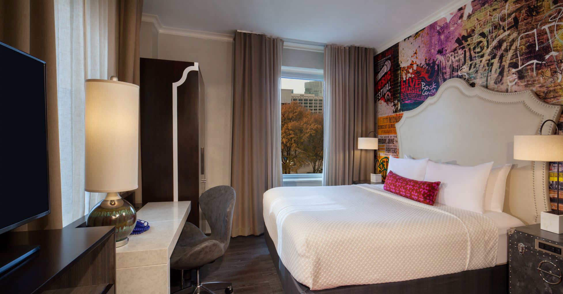a room with a bed and a desk