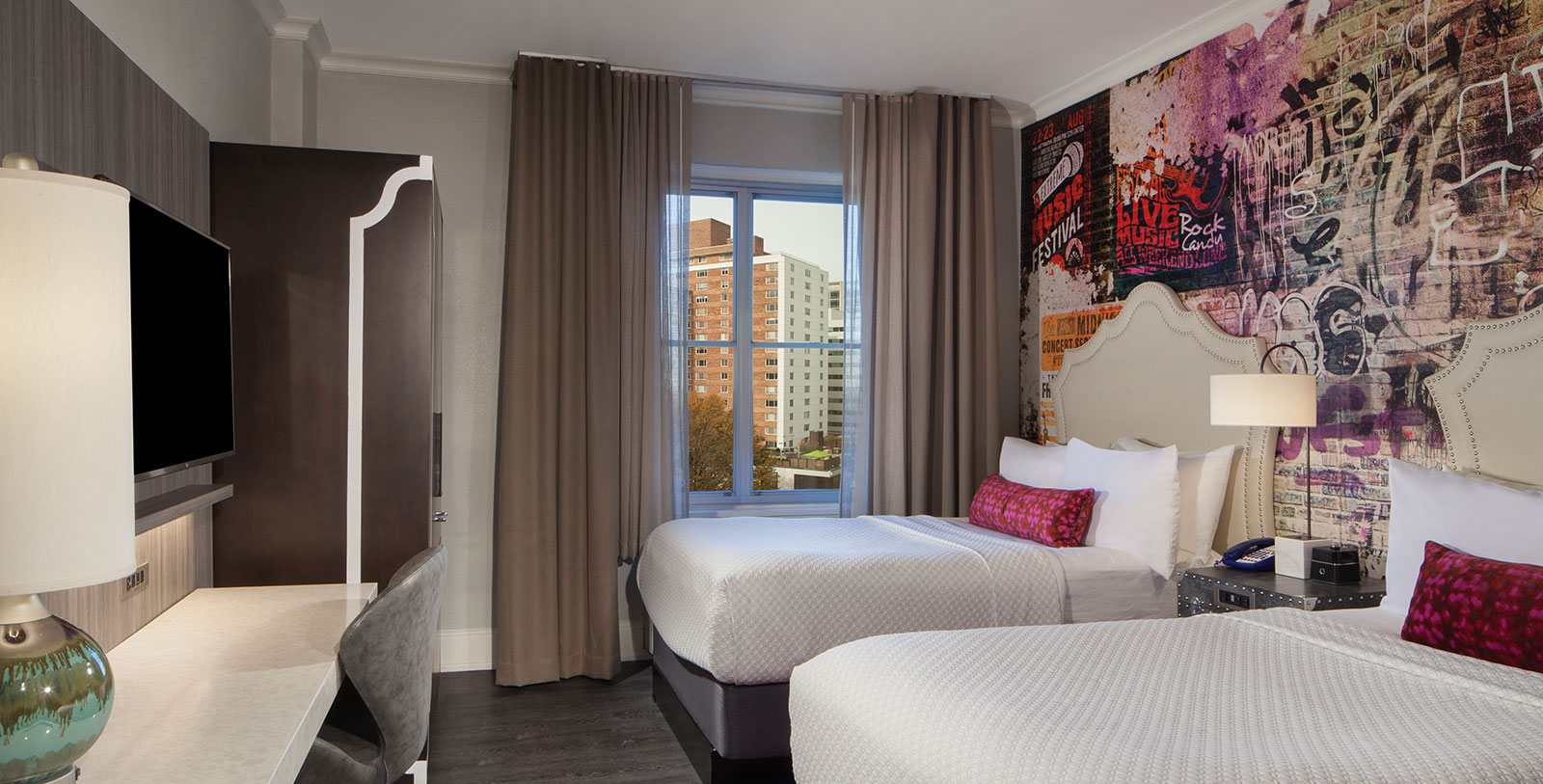 a room with two beds and a window