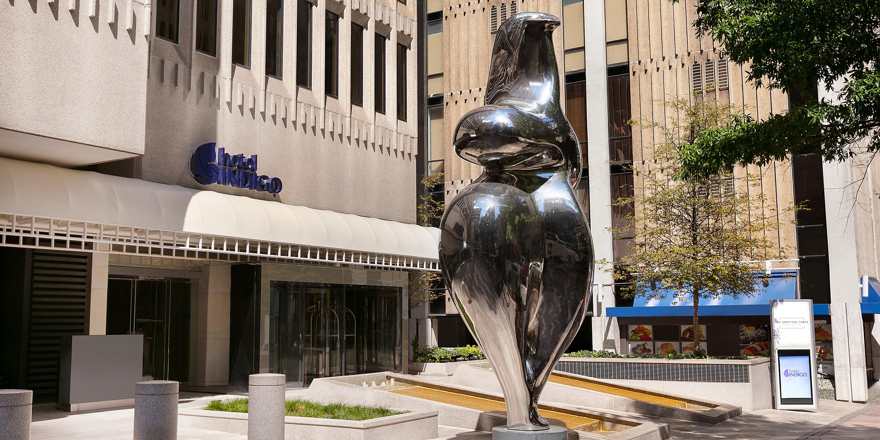 a statue of a woman in a city