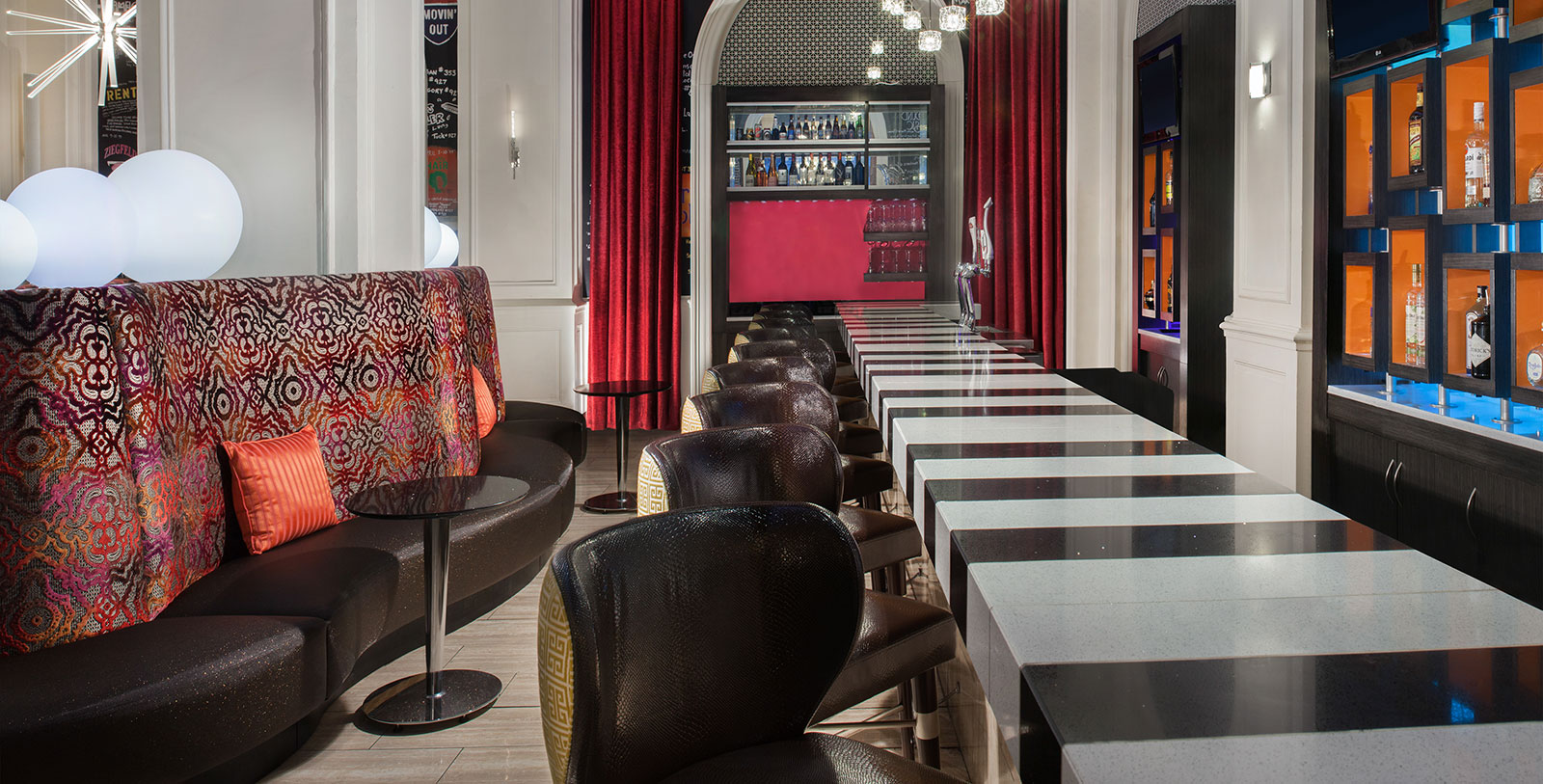 a bar with chairs and a counter