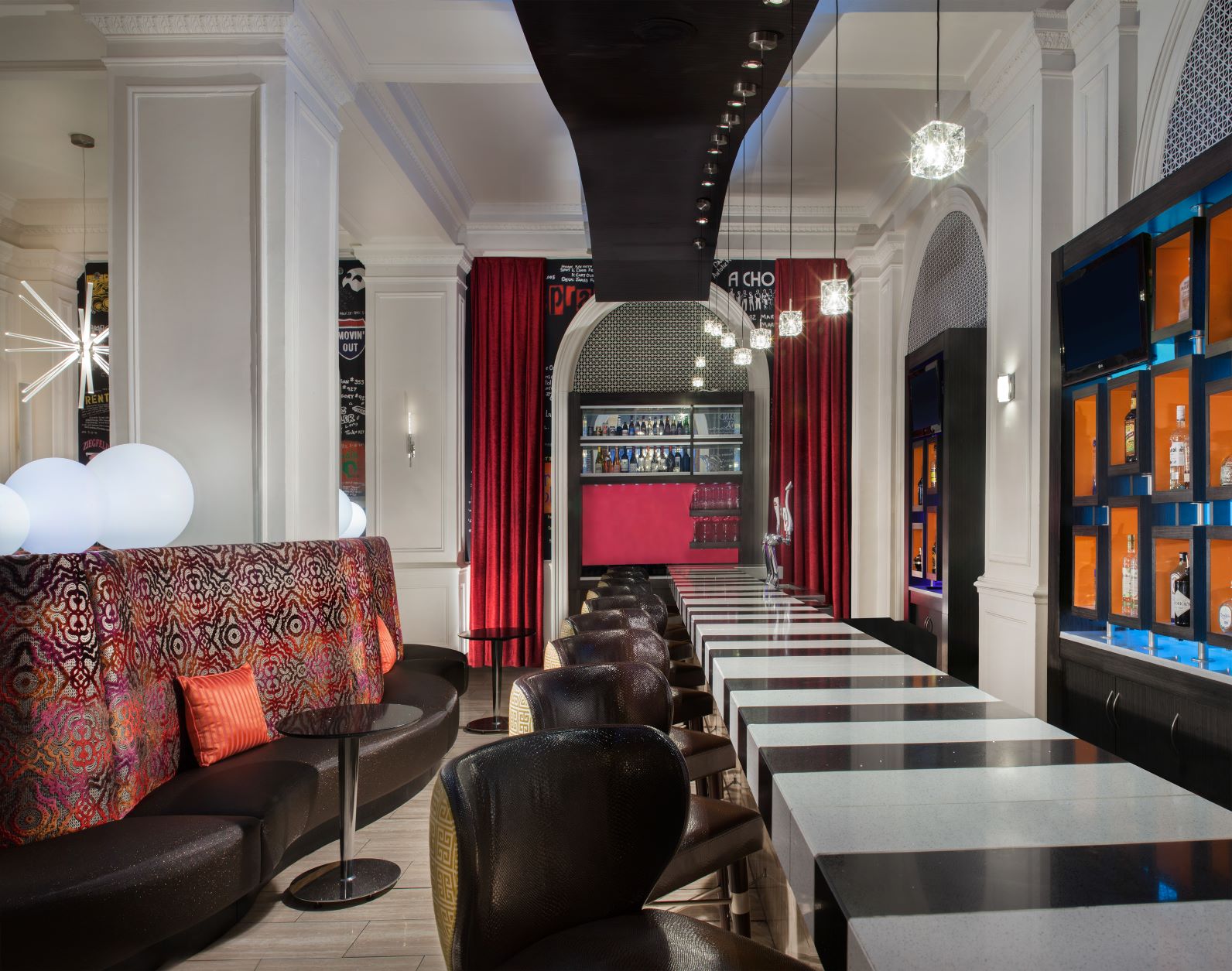 a room with a long table and chairs