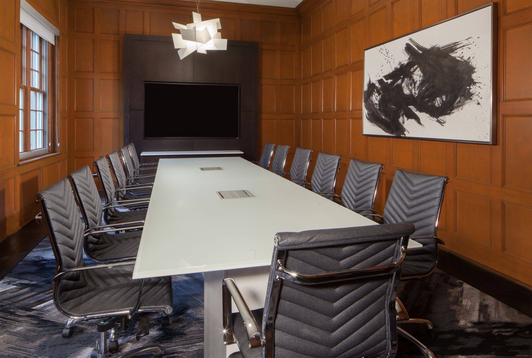 a conference room with a table and chairs