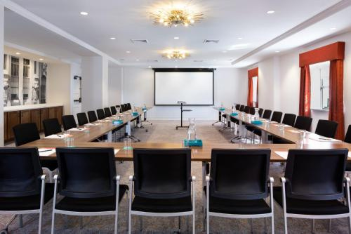 a room with a large table and chairs