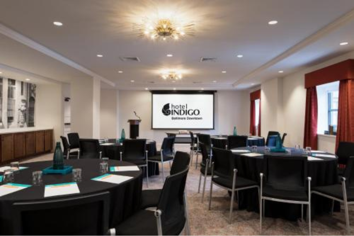 a room with black chairs and tables