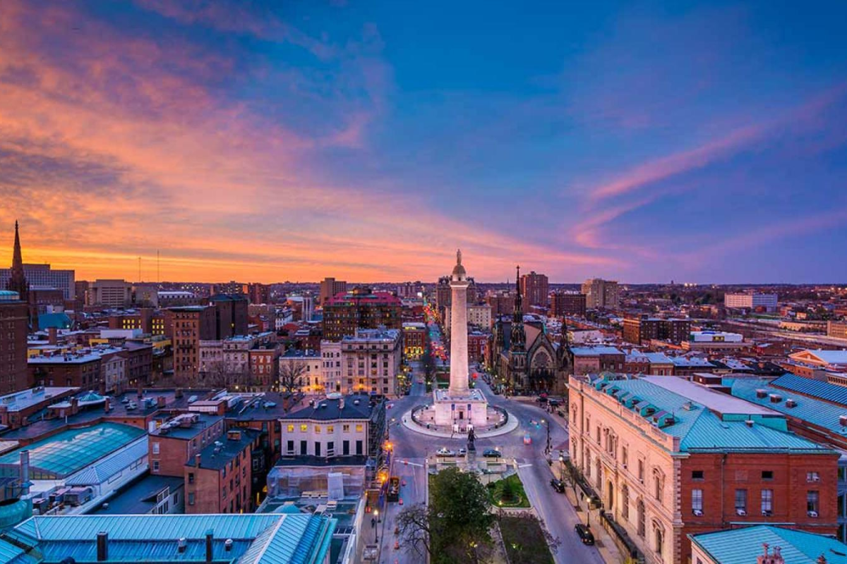 a city with a monument and buildings