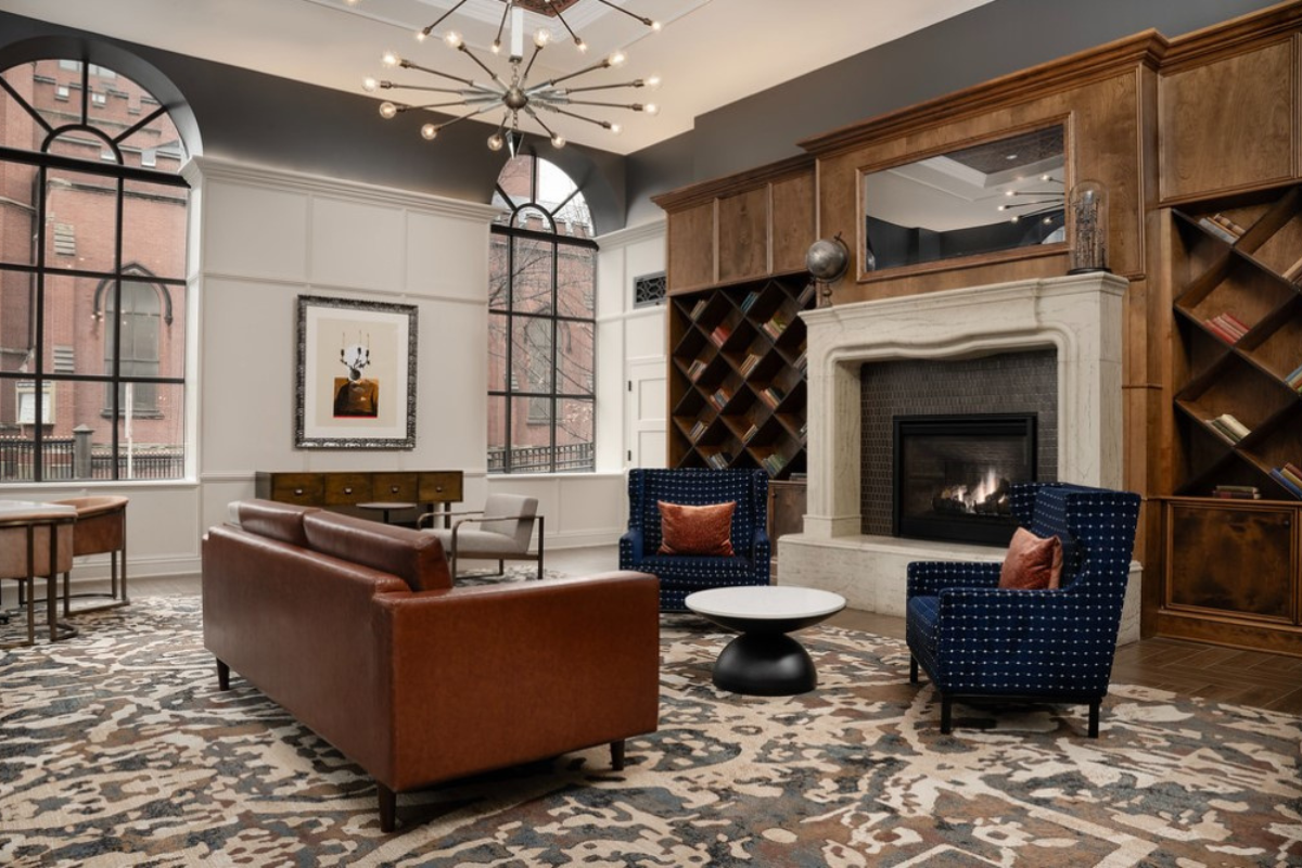 a room with a fireplace and couches