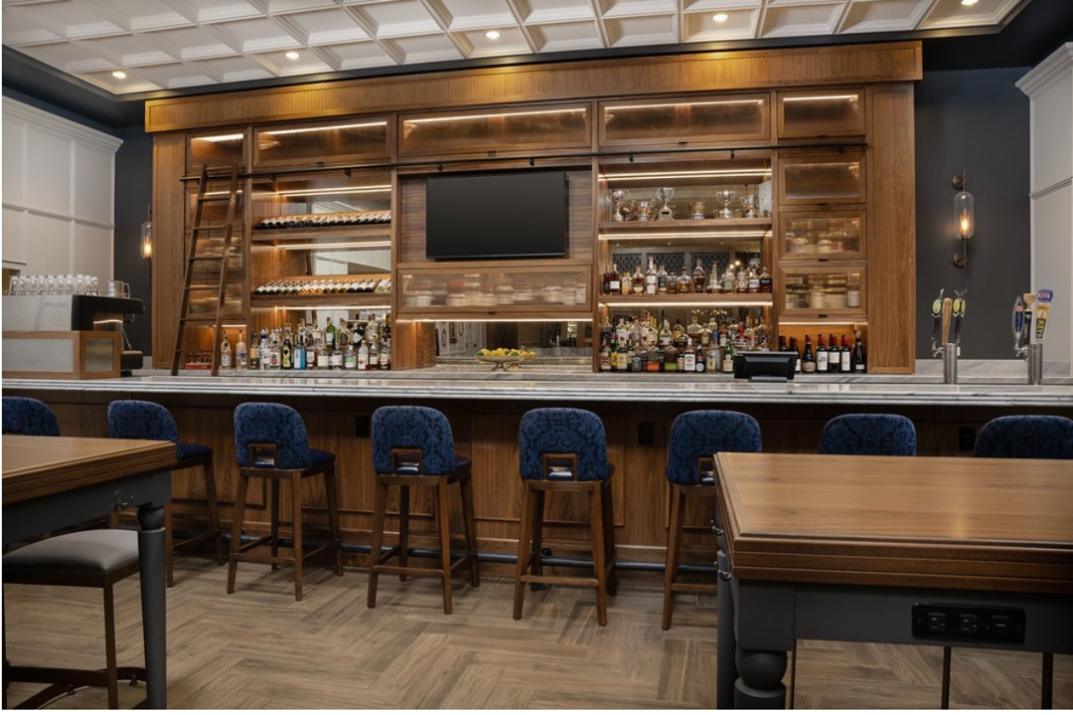 a bar with shelves and shelves of liquor