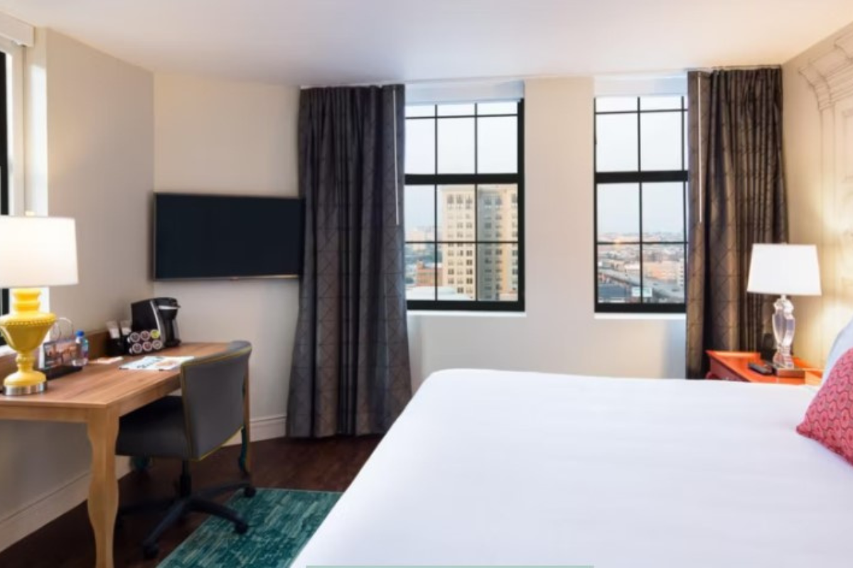a room with a bed and desk