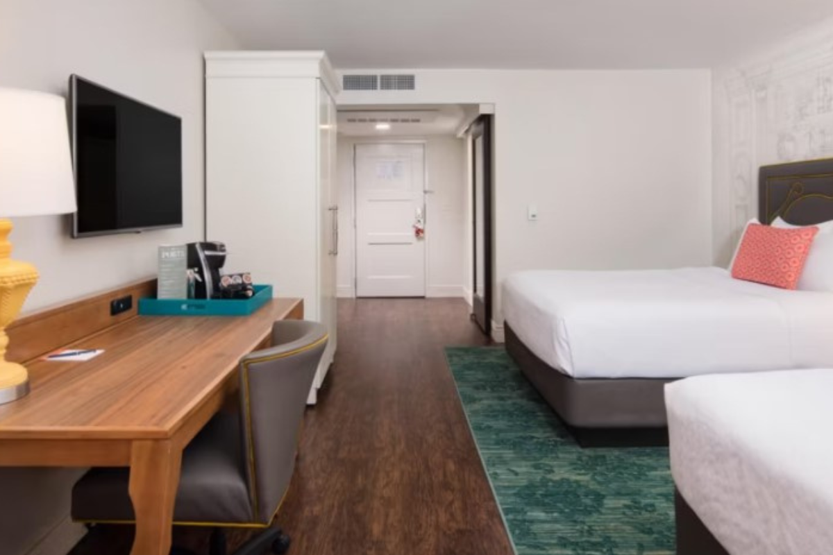 a room with a bed and a desk